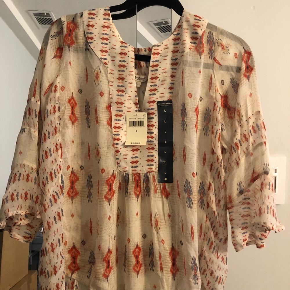 I am selling Lucky Brand loose blouse.